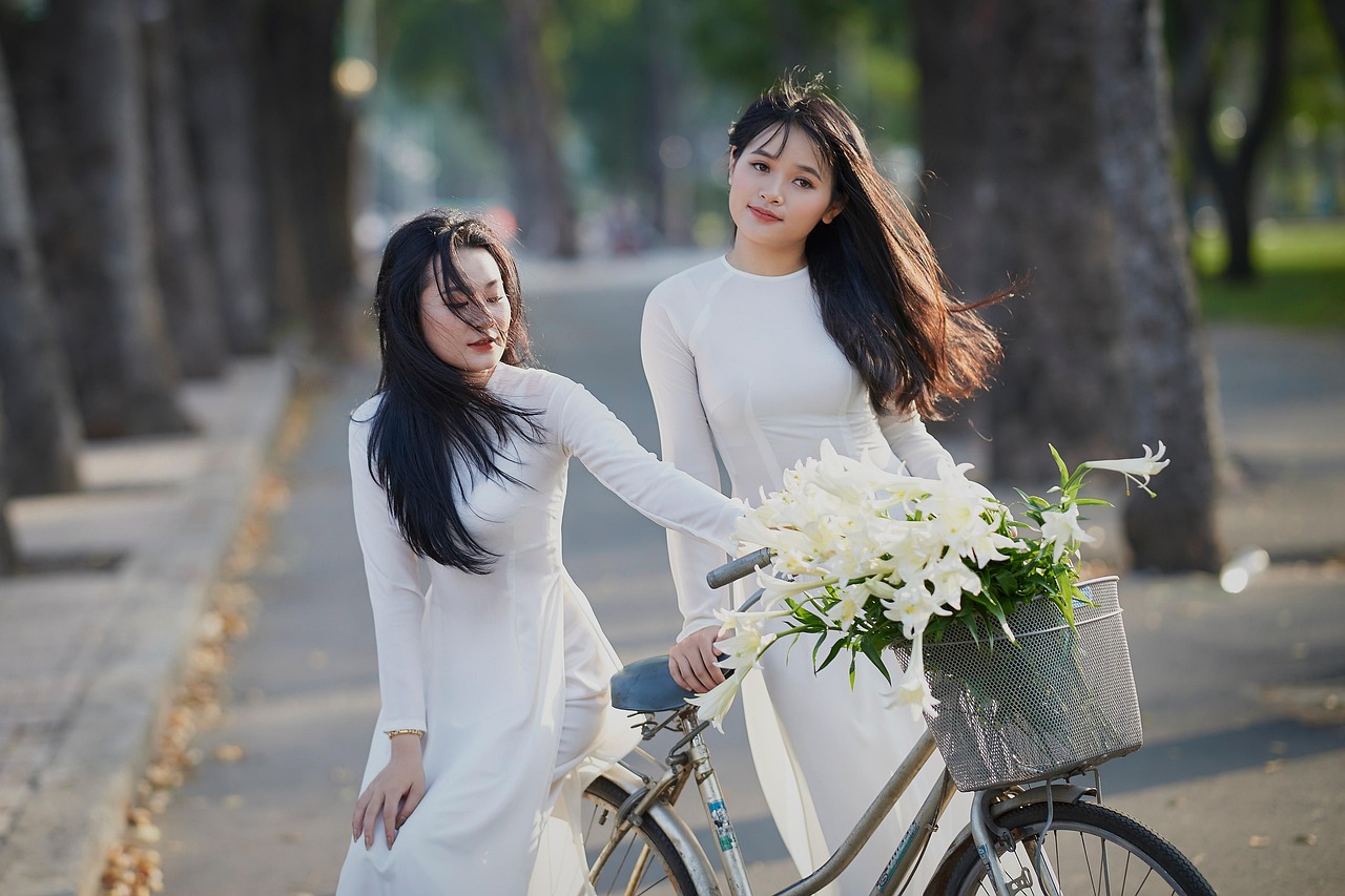 women, ao dai, bicycle, girls, friends, flower background, fashion, dress, beautiful, lilies, flowers, friendship, happy, bike, road, beautiful flowers, outdoors, flower wallpaper, nature, asian women, ho chi minh city