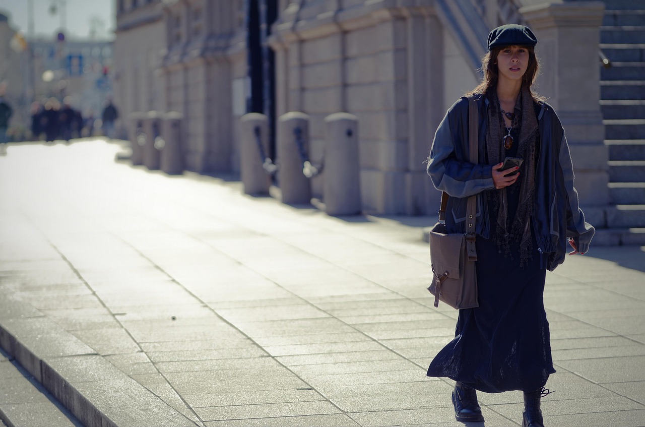 fashion, purse, urban, city, woman, casual, caucasian, walking, pavement, sidewalk, street, buildings, cap, bag, sunny, snapshot, street photography, autumn, pretty