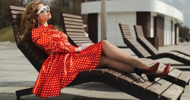 woman, polka-dot dress, retro, vintage, red dress, classic, cocktail dress, pose, model, vintage fashion, retro style, embankment, river, moscow river, portrait, glasses, sunbed, deck chair, sunbathe