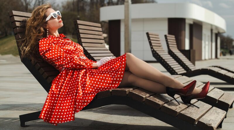 woman, polka-dot dress, retro, vintage, red dress, classic, cocktail dress, pose, model, vintage fashion, retro style, embankment, river, moscow river, portrait, glasses, sunbed, deck chair, sunbathe